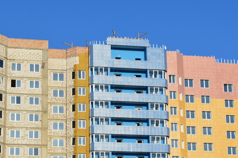 yellow, wall building, nature, concrete, residential district, the façade of the, daytime, blue, sky, housing development, home construction, insulation