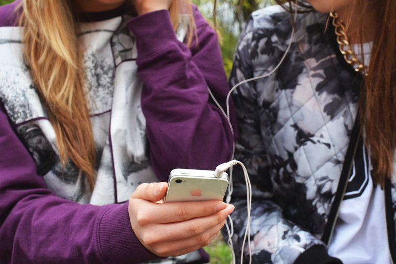 phone, friends, mobile phone, smartphone, warm clothing, midsection, one person, music playback, cell phone, sound, portable information device, using phone