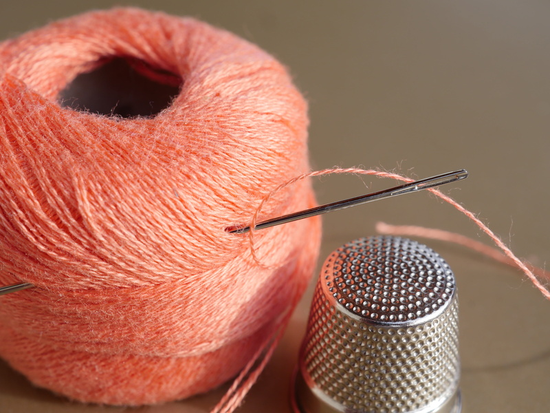 sewing thread, coil, yarn, holding, schneider, beside, accuracy, sewing kits, indoors, day, hand labor, concentration, colored background, sew, role, close