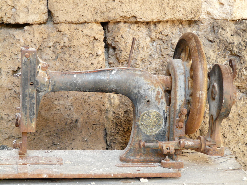 sewing, craft, built structure, wood, rusty, obsolete, water, day, water pipe, close-up, deterioration, machine, oil industry, weathered, equipment, treadle