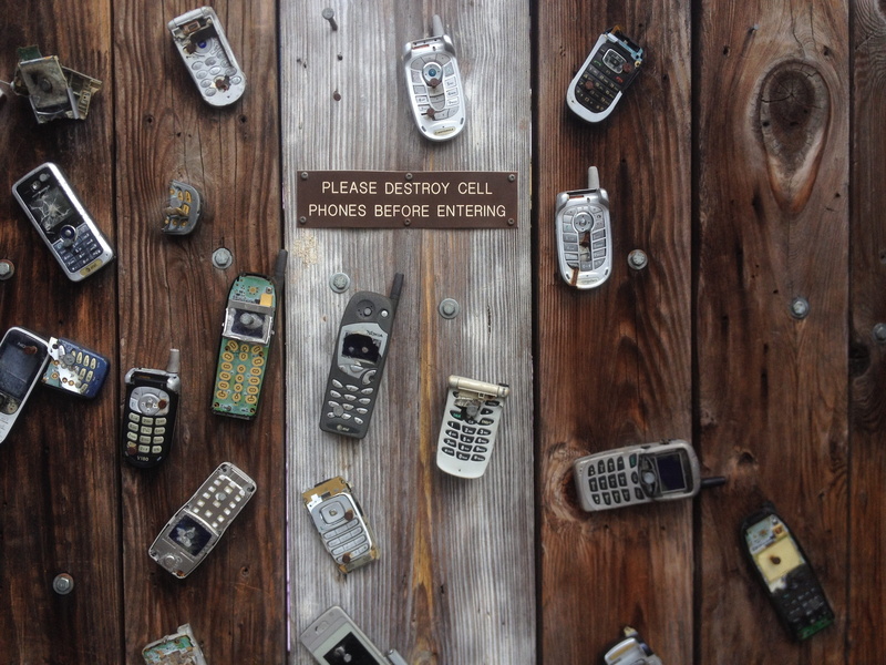 wood, text, table, wood - material, brown, rustic, high angle view, dirty, cell phone, security, indoors, label, directly above, no people, still life