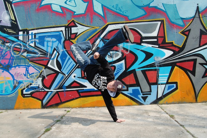 2K, city, lifestyles, breakdance, full length, casual clothing, real people, body, built structure, adolescence, street art, leisure activity, stand, multicolored