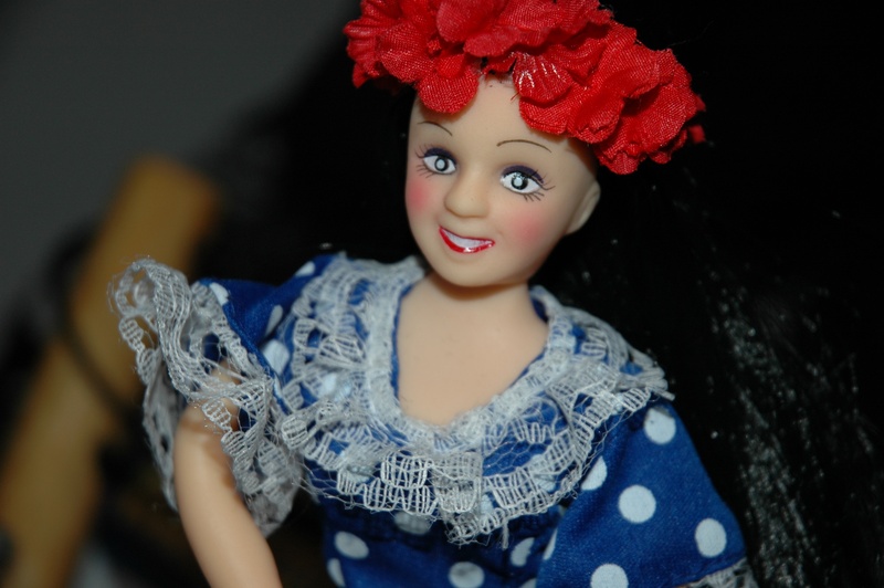 women, real people, beauty, cheesy, hawaiian, plastic doll, souvenir, close-up, red, figurine, one person, clothing, indoors, leisure activity, looking at camera