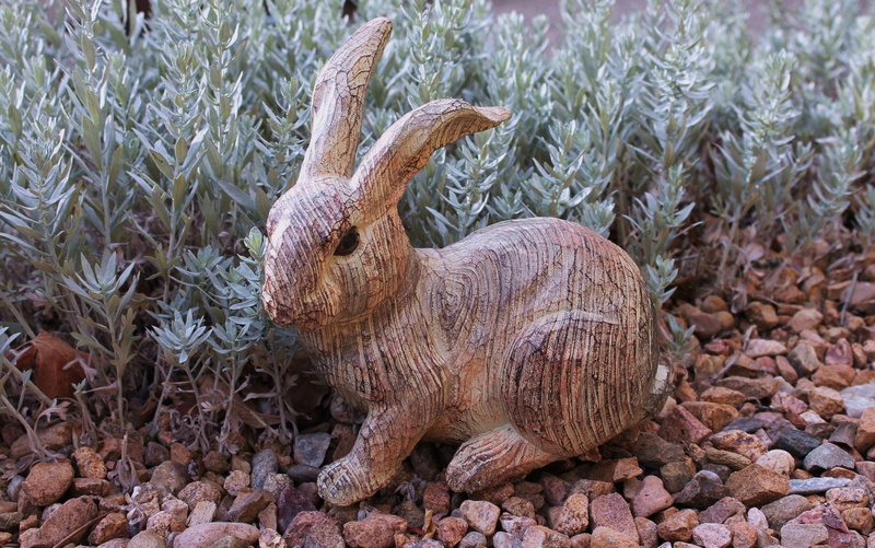 outdoor art, animal art, garden art, outdoors, vertebrate, animal, animal body part, field, garden, landscaping, land, rabbit art, nature, animal sculpture