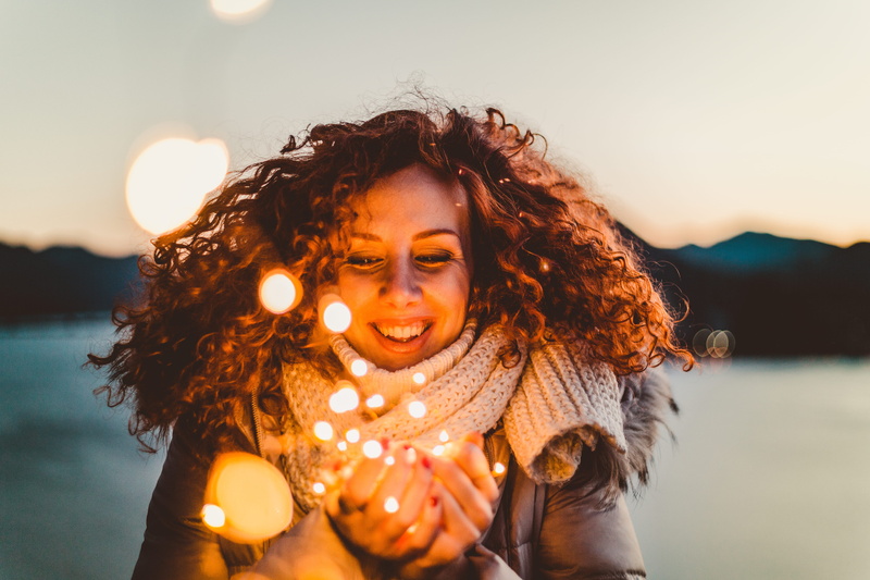 leisure activity, portrait, lens, hair, wearing, illuminated, hairstyle, shift, smiling, scarf, one person, female, wear, jacket, outdoors, women, real people
