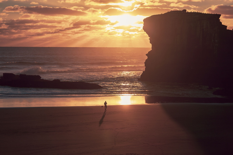 shoreline, beauty in nature, nature, rock - object, tranquil scene, rock, rock formation, outdoors, horizon over water, person, dawn, sky, cloud - sky