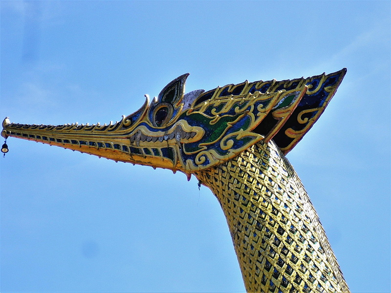 sky, statue, the past, skull, history, gold, low angle view, dragon, outdoors, colored, dragons head, temple, clear sky, animal representation, day, brass