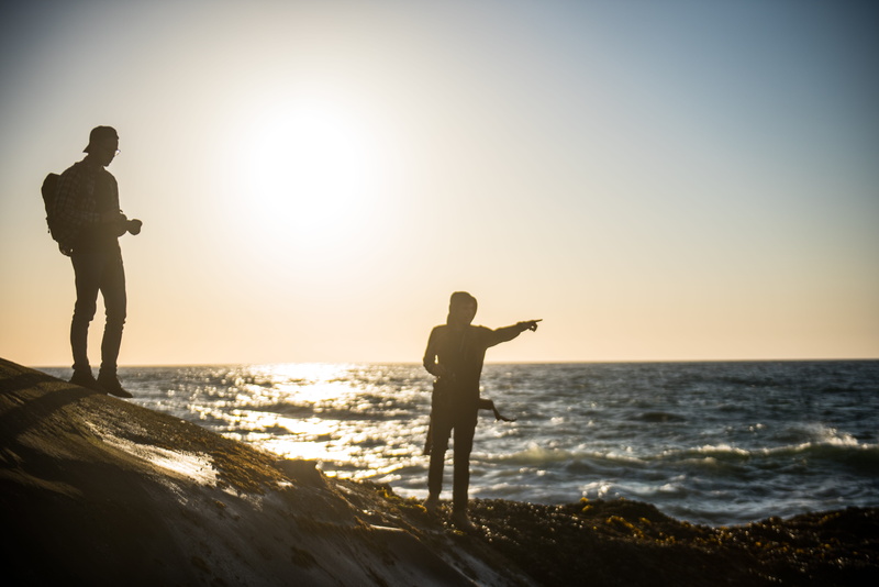 man, cape, sea, horizon over water, horizon, land, ocean, blue, scenics - nature, lens flare, coast, full length, cape kiwanda state natural area, backpack