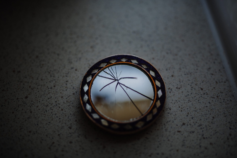 geometric shape, personal accessory, close-up, jewelry, focus on foreground, time, broken, selective focus, crack, vignette, high angle view, single object