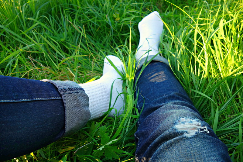 nature, land, limb, relaxing, outdoors, jeans, feet, low section, grass, denim, adult, casual clothing, summer, personal perspective, shoe, real people