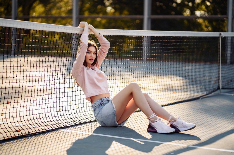 tennis court, denim skirt, sitting, 1080P, women, looking at viewer, sneakers, women outdoors