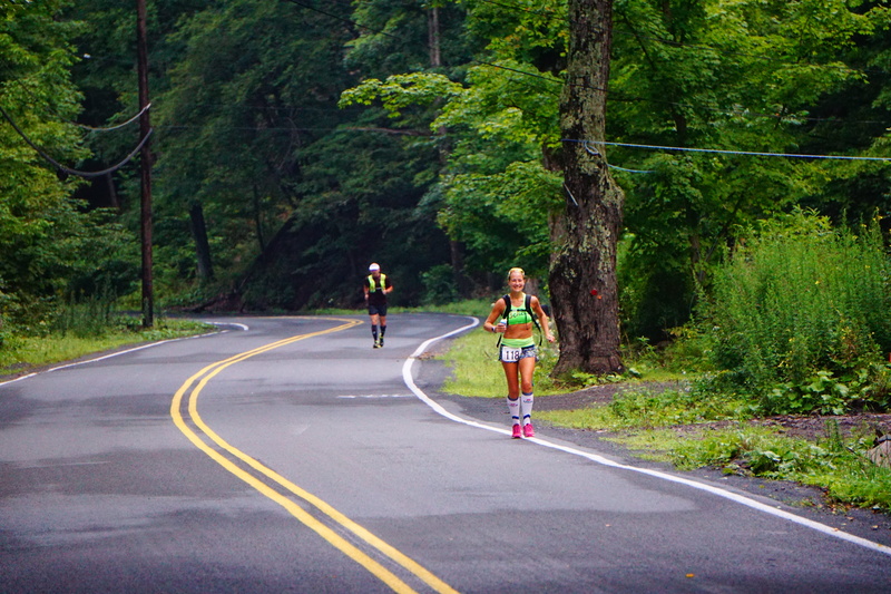 human, sport, shorts, cross country, person, road, clothing, forest, running, sign, people, path, apparel, the way forward, 5K, leisure activity, plant