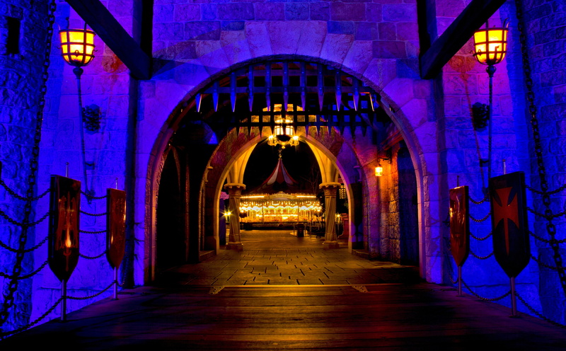 indoors, architecture, direction, metal, absence, religion, purple light, arched, amusement park, built structure, night, light, arch, empty, gray, entrance