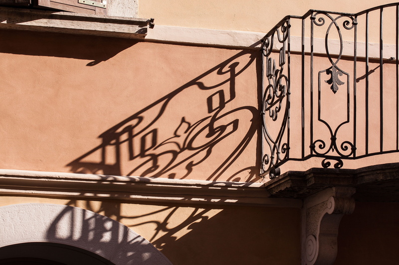 art and craft, italy, sunlight, outdoors, curlicue, building exterior, style element, grid, built structure, shadow, metal decorating, structures, wall - building feature