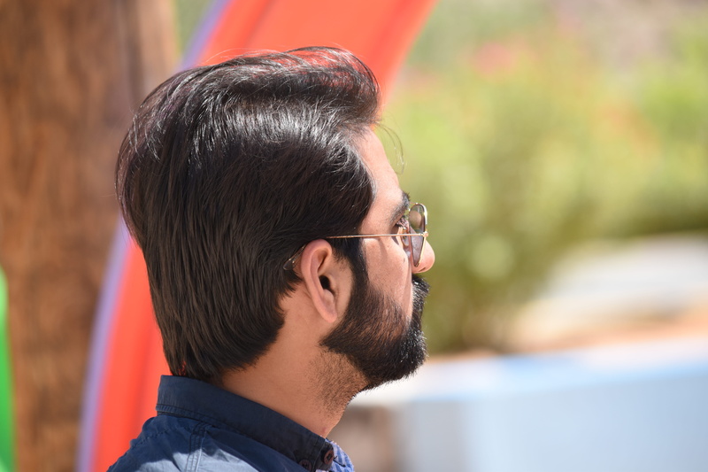 hairstyle, focus, facial hair, focus on foreground, leisure activity, portrait, hair, selective, facial expression, young men, headshot, man, park, person