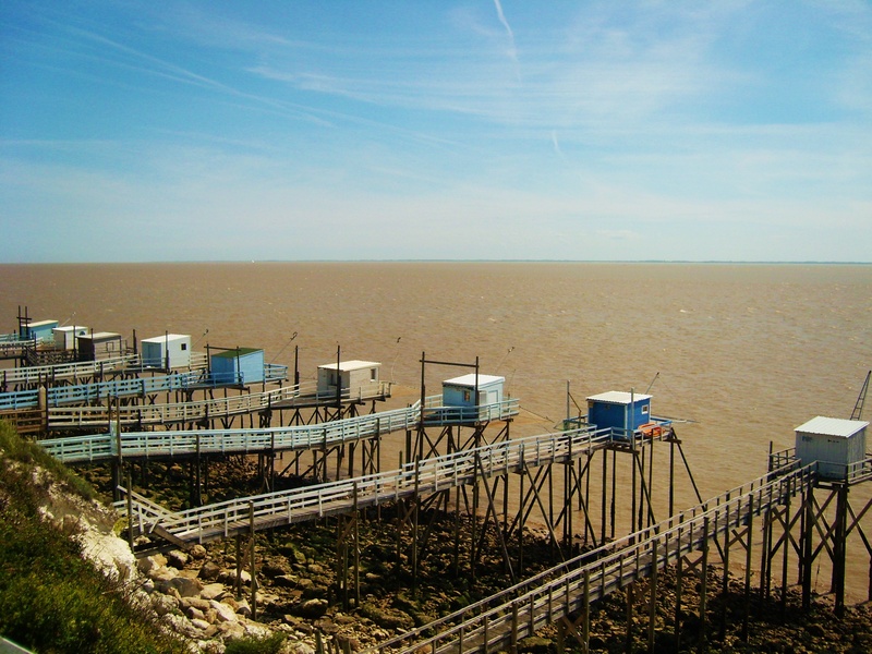 land, tranquil scene, built structure, fishing, outdoors, tahmasebi on gironde, no people, horizon over water, ocean, cabin on stilts, railing, scenics - nature