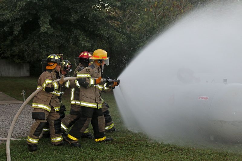 men, nature, firemen, clothing, protection, water, training, teamwork, equipment, tree, group of people, hose training, hose, propane tank, fog, fire fighters