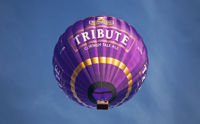corning, st austell, heat, multi colored, balloon, blue, clear sky, buoyancy, mode of transportation, pale, mid-air, sky, burn, ale, propane, hot air balloon