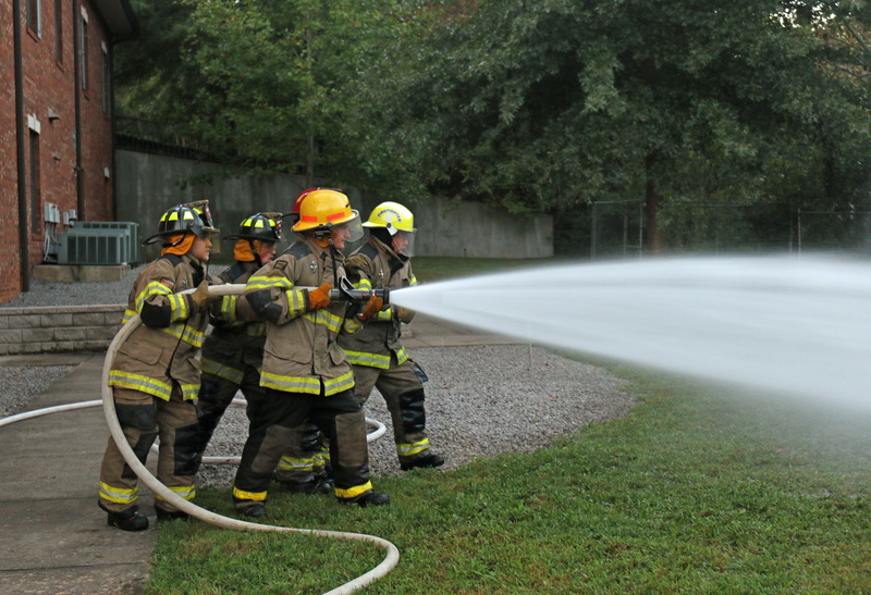 water, spray, headwear, outdoors, hose training, plant, fire, motion, teamwork, clothing, security, team, group of people, day, uniform, men, Hose, Training