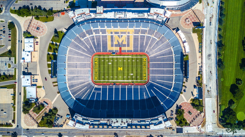 soccer, circle, no people, day, shape, outdoors, building exterior, city, aerial, grass, green color, aerial view, american, drone view, architecture, sport