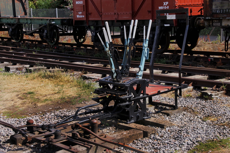 structure, outdoors, complexity, rail transportation, day, gear, land vehicle, way, plant, steel, choice, rail, crisscross, rust, traffic, crossover, metal