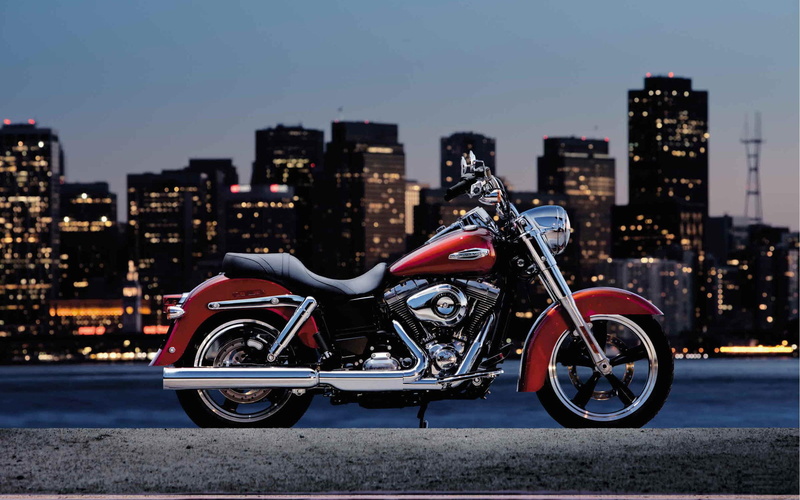 road, transportation, cityscape, gray, switchback, outdoors, cruiser, motorcycle, focus on foreground, building, stationary, Harley Davidson, Motorcycles