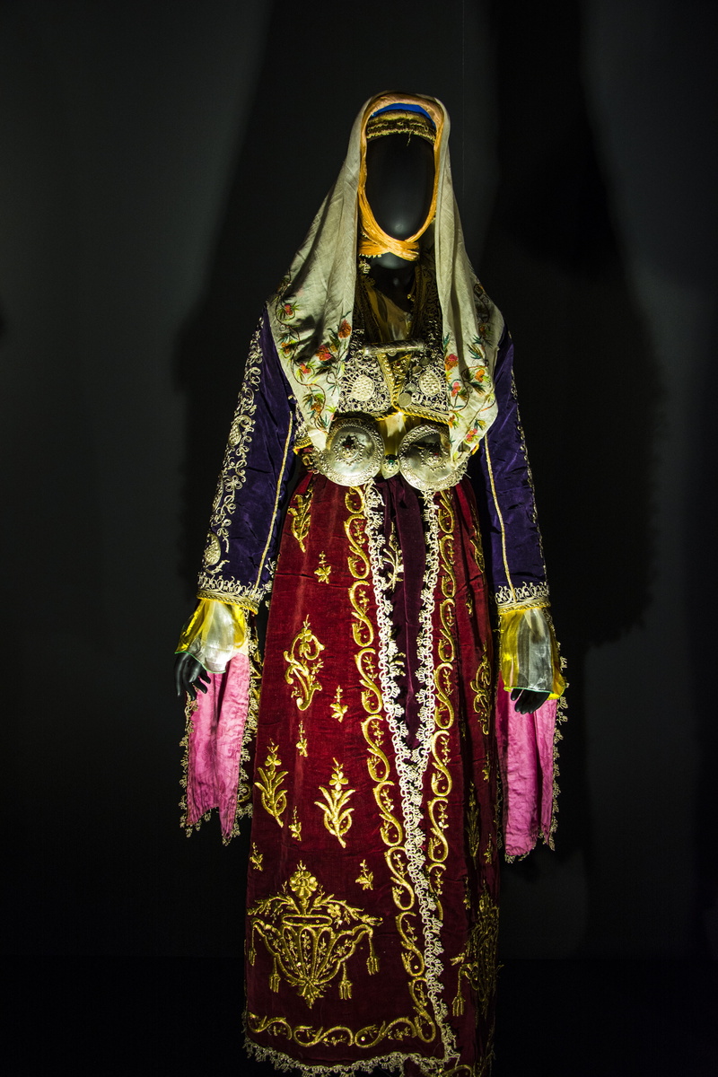 midsection, folkloric, obscured face, traditional clothing, one person, front view, celebration, standing, festival, hanging, studio shot, date, history
