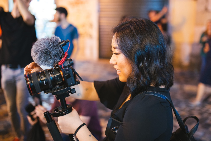 professional occupation, young women, journalist, holding, photography themes, camera - photographic equipment, videographer, group of people, camera operator
