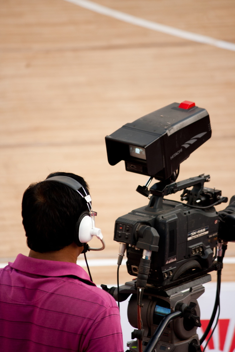 headphones, occupation, camera - photographic equipment, people, videography, photographic equipment, camera operator, tripod, videographer, man, focus on foreground