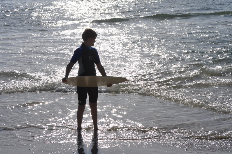 nature, innocence, males, real people, standing, sea, childhood, leisure activity, boy, beach, child, water, lifestyles, skimboard, beauty in nature, lifestyle