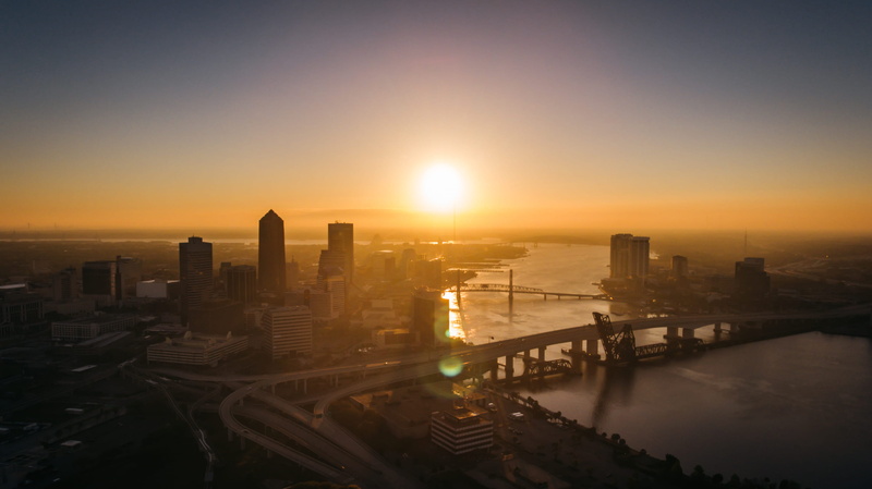 city, building exterior, cityscape, modern, skyscraper, jacksonville, development, golden hour, united states, urban skyline, sun, river, building, above