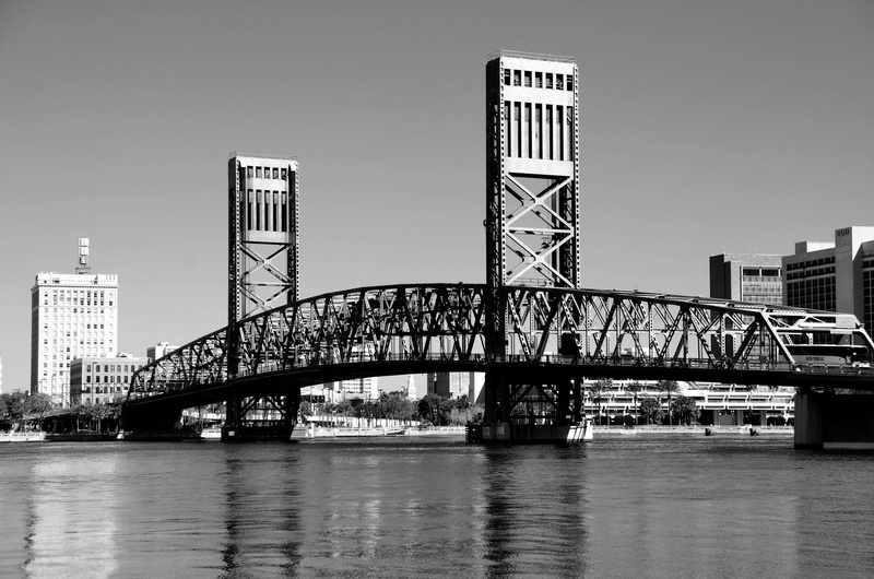 attraction, bridge, reflection, landmark, skyscraper, cityscape, water, skyline, place, tourism, no people, arch bridge, monochrome, built structure, sky