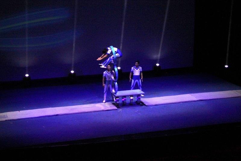 light, jumping, two people, stage, nightlife, occupation, flying, full length, real people, lighting equipment, skill, indoors, purple, people, standing