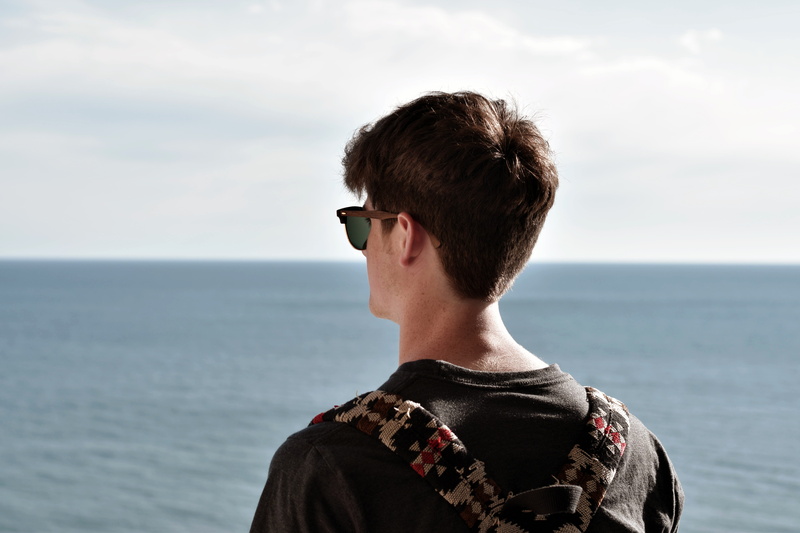 standing, fashion, united states, headshot, outdoors, real people, glasses, water, young adult, horizon, beauty in nature, horizon over water, ocean view