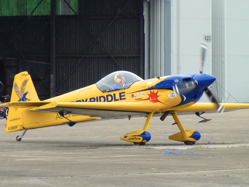 piloting, precision, yellow, architecture, day, retro styled, army, acrobatic, mode of transportation, side view, military, plane, aviation, single object