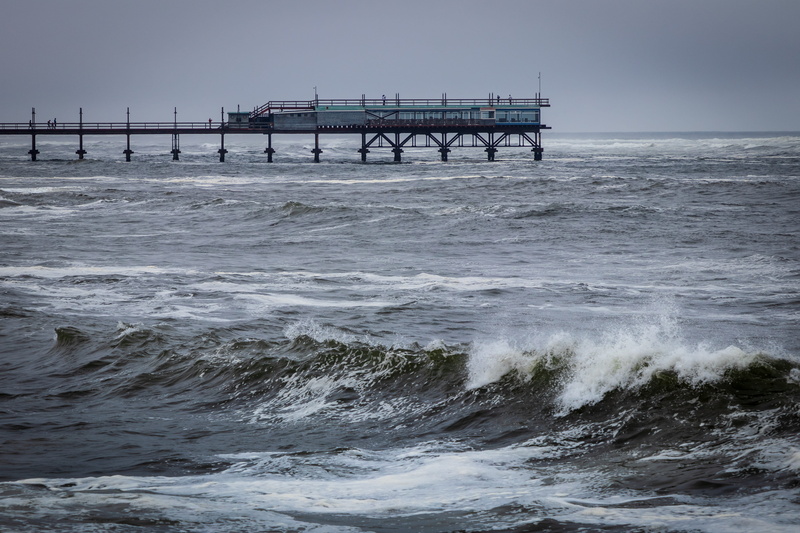 sport, ocean, sky, handrail, motion, tsunami, banister, outdoors, pier, wave, sea waves, bridge - man made structure, scenics - nature, waterfront, beauty in nature