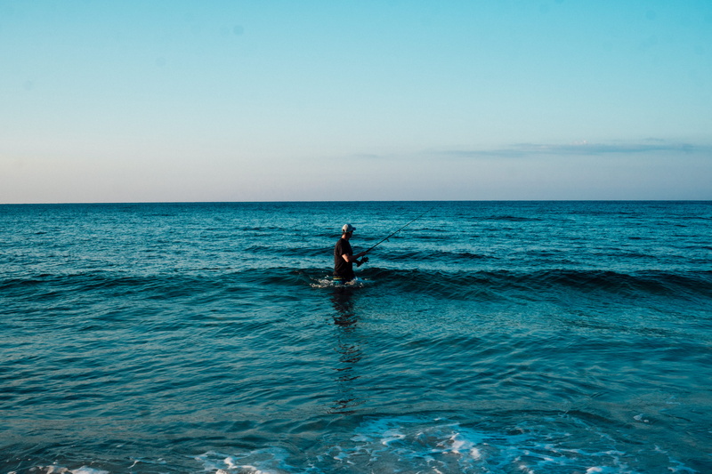 oceans, surfing, blue sky, standing, sky, clear sky, man, leisure activity, 5K, sea, water, fishing, scenics - nature, waterfront, sport, body, one person