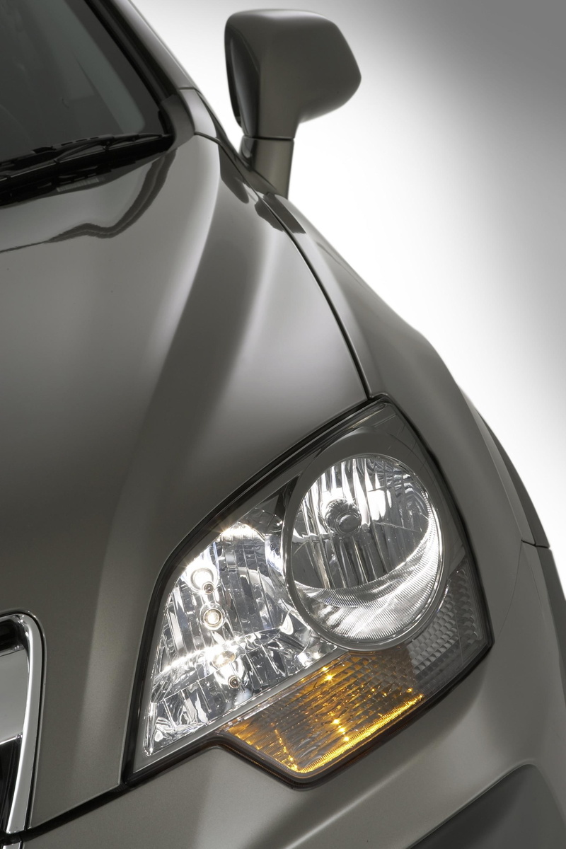 holden, indoors, glass - material, safety, captiva, luxury, electric lamp, car, silver colored, exterior, shiny, reflection, window, transportation, lighting equipment