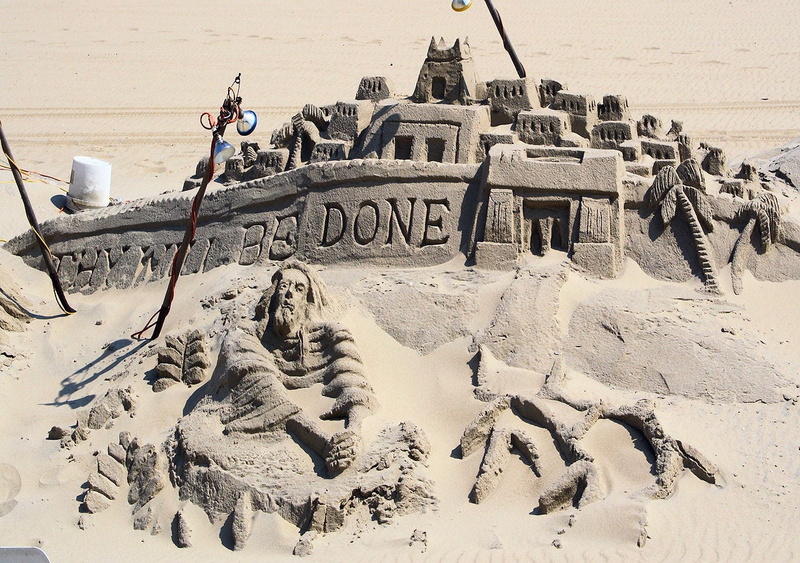 holiday, people, trip, real people, symbols, sand, architecture, vacations, art and craft, built structure, beach, sandcastle, sunlight, artists, day, sculptures