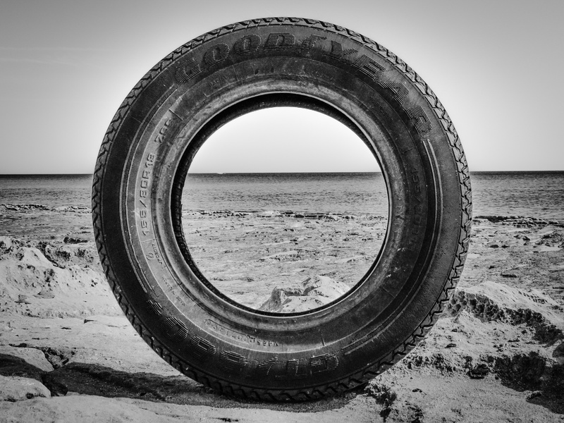 used, discarded, waste, beach, recycling, tire, horizon over water, nature, day, outdoors, geometric shape, sky, goodyear, scenics - nature, sea, circle