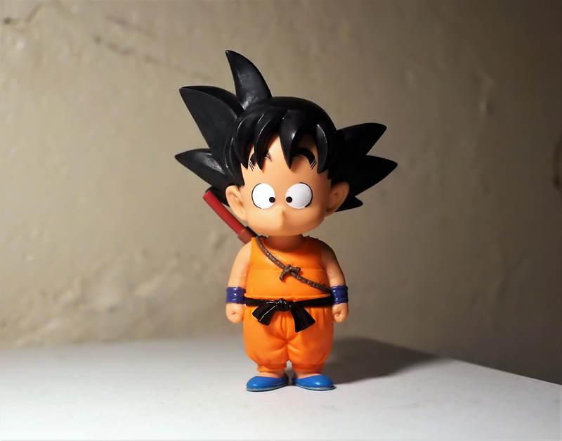 wall - building feature, plastic, table, z, character, craft, television, toy, indoors, tv, figurine, small, representation, ball, cartoon, male likeness