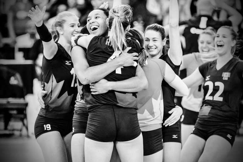 group of people, young adult, hugging, vitality, stadium, enjoyment, three quarter length, volleyball, real people, happiness, young, wear, facial expression