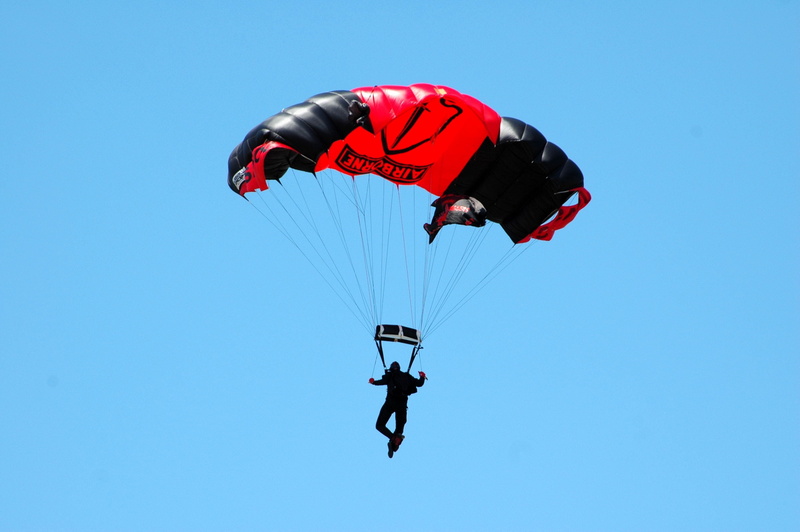 outdoors, leisure activity, low angle view, flying, recreation, action, falling, freedom, danger, joy, jumper, sport, sky, parasailing, motion, parachutist