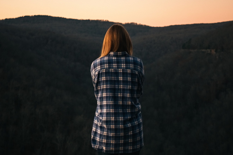 black, hairstyle, women, teenager, beauty in nature, long hair, lifestyles, checked pattern, sky, tattersall, one person, mountain, check, looking at view