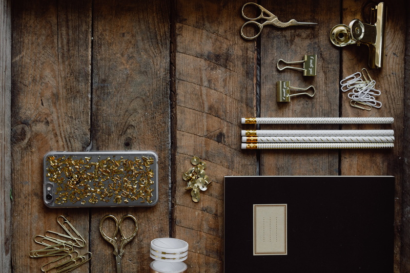 iphone, tray, no people, indoors, frame, metal, gold, wooden, picture frame, still life, office, arrangement, notebook, golden, table, large group of objects