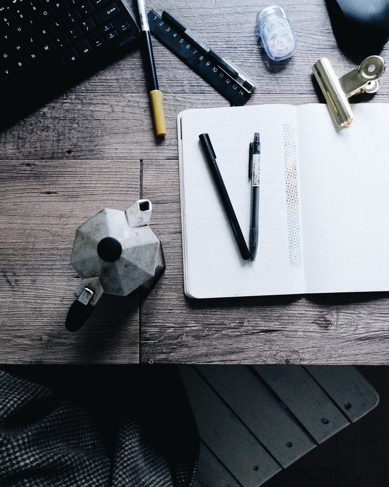 representation, pen, wood, wood - material, no people, italy, milan, journal, high angle view, coffee, tool, indoors, equipment, group of objects, pens