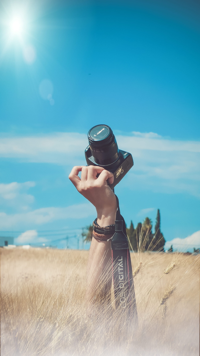 water, outdoors, land, adult, nature photography, man, summer, beach, digital camera, recreation, leisure, royalty  images, human hand, relaxation, human body part