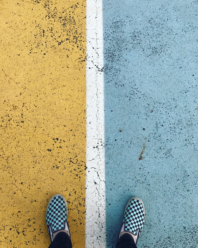 day, body part, black, marking, vans, unrecognizable person, margin, wearing, real people, close-up, men, paint, lifestyles, human limb, shoes, standing
