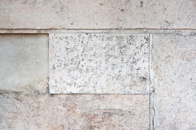 text, script, weathered, built structure, rough, history, hard, building exterior, margin, non-western script, information, close-up, no people, backgrounds
