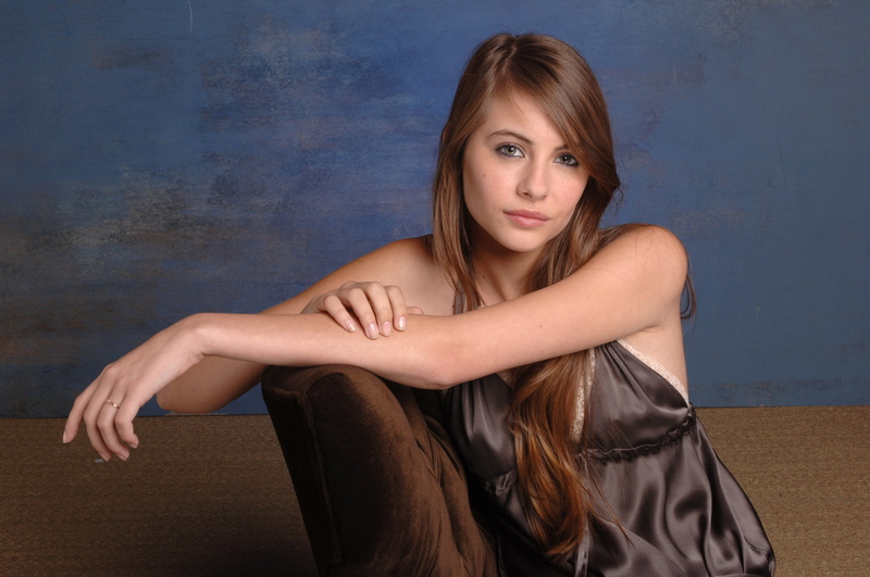 one person, front view, blue eyes, beauty, women, portrait, young adult, brown hair, blue background, dress, sitting, Willa Holland, chair, beautiful woman
